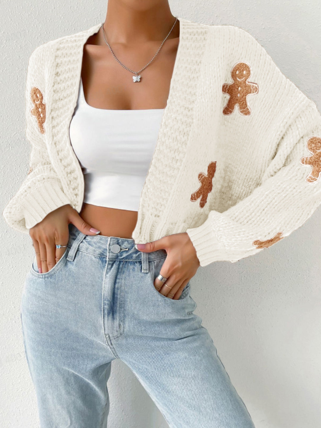 Stickad tröja med pepparkaksgubbe och V-ringning, S–XL